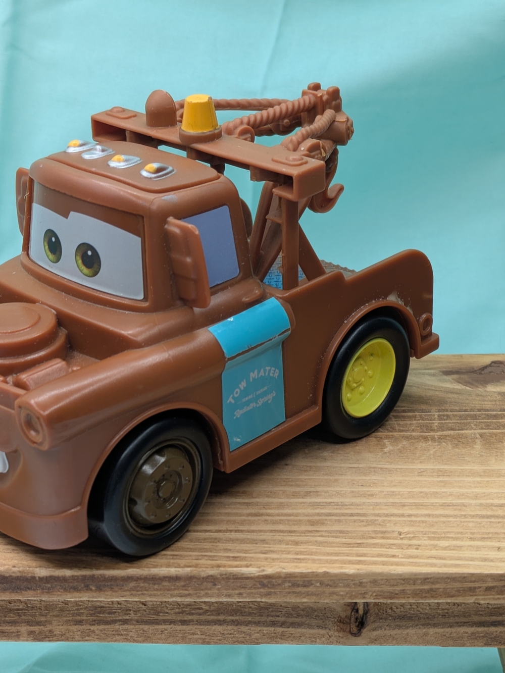 Disney Brown Tow Mater Toy with Yellow Wheels and Blue Door Panel